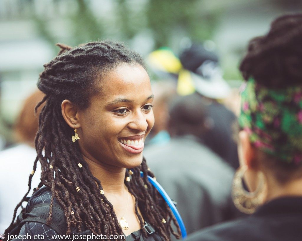 street photography of a photo of two women sharing a laugh at the Notting Hill Carnival in London
