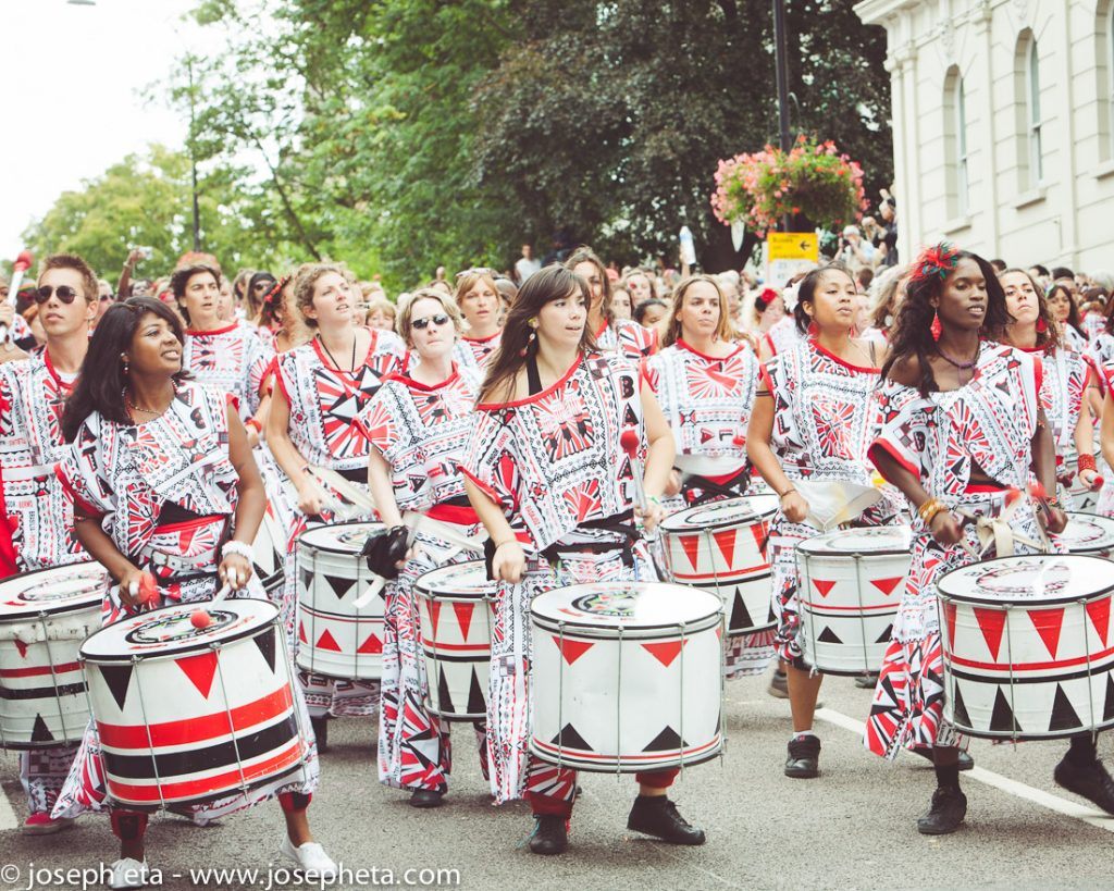 photo of a carnival band drumming samba during the Notting Hill Carvinal in London