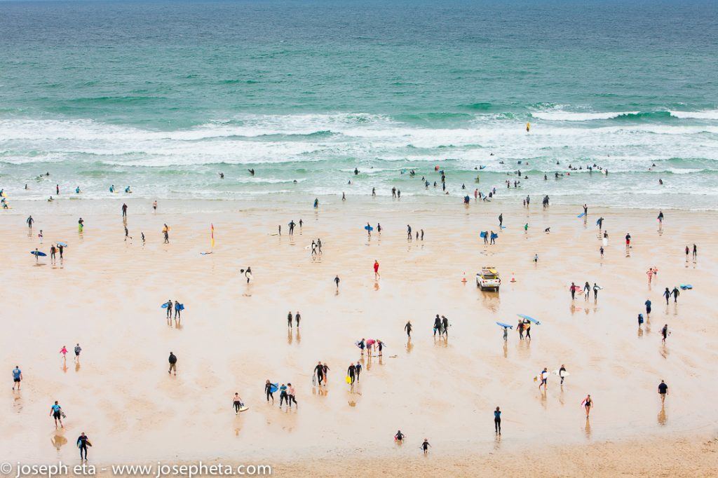 A photo of surfers at Watergate Bay in Newquay in Cornwall