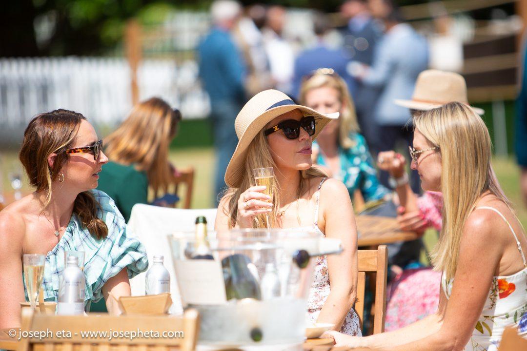 Ladies sipping champaign at The Boodles Tennis Challenge