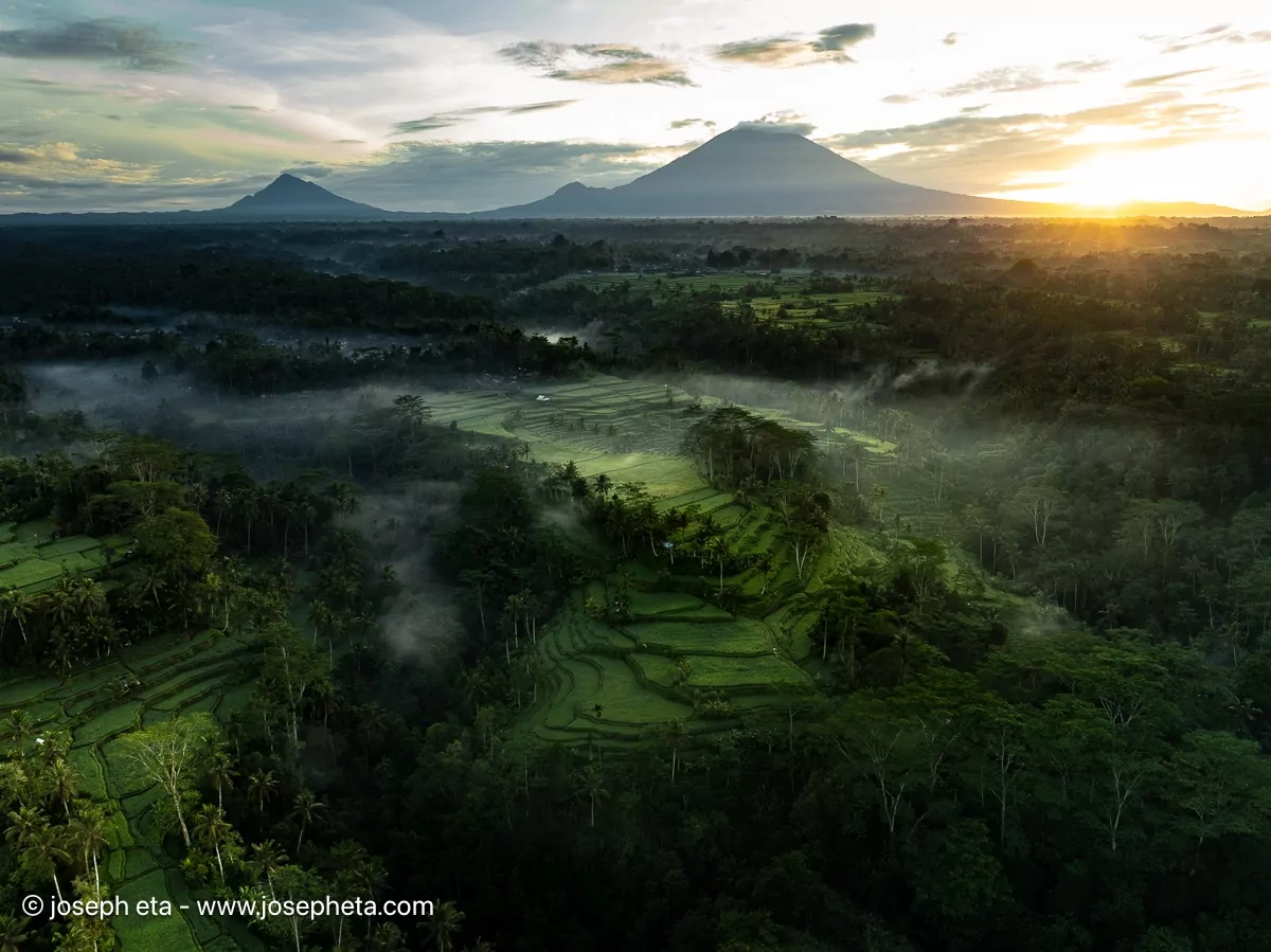 Panoramic sunrise over misty mountains. 