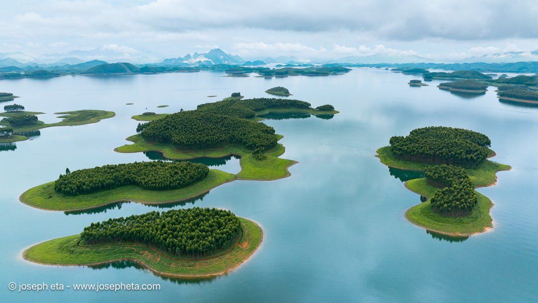 These soft, rounded island clusters provide an almost comforting contrast to the jagged mountains seen earlier. The large fields of