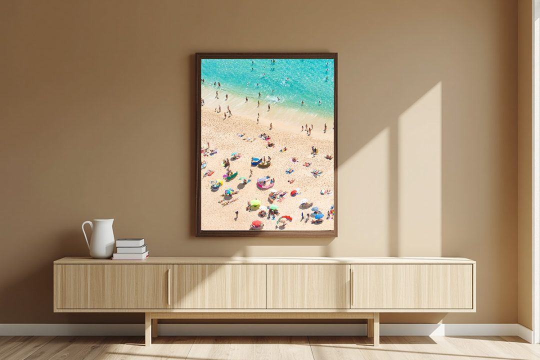 Contemporary living room featuring a large fine art coastal print framed over a minimalist wood console table.