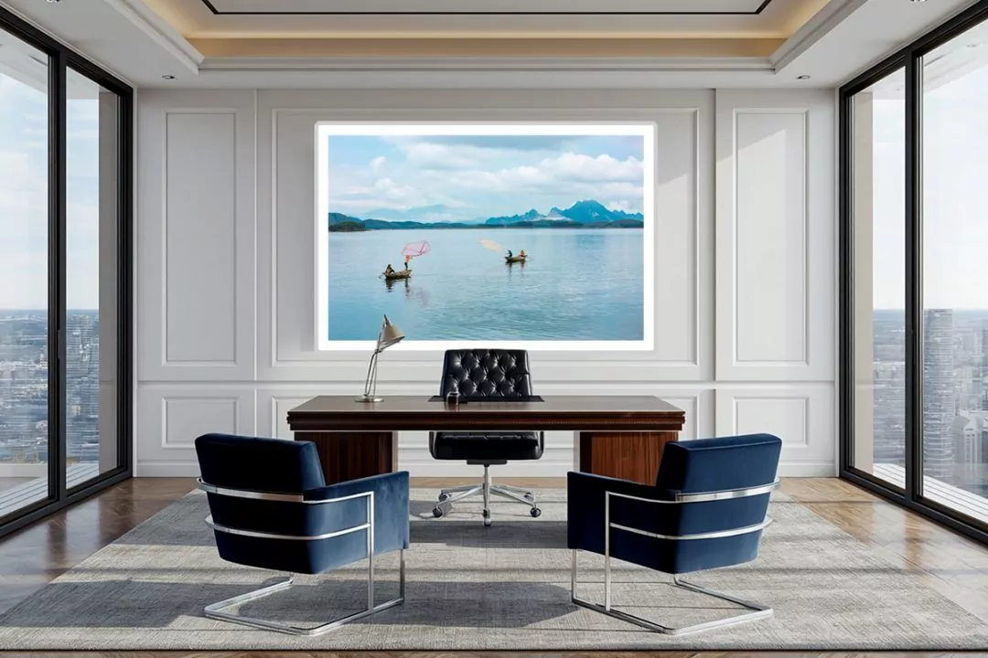Precision in Motion. Anchoring a crisp, bespoke gallery-style executive suite. The sharp geometry of the white wall paneling and the rich navy velvet chairs physically extend the calculated precision and clear atmospheric blues of the decisive moment on the water.